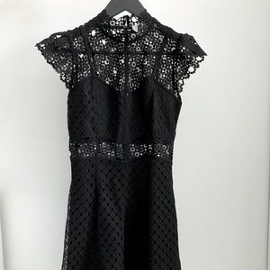 Sandro black lace cap sleeve dress.